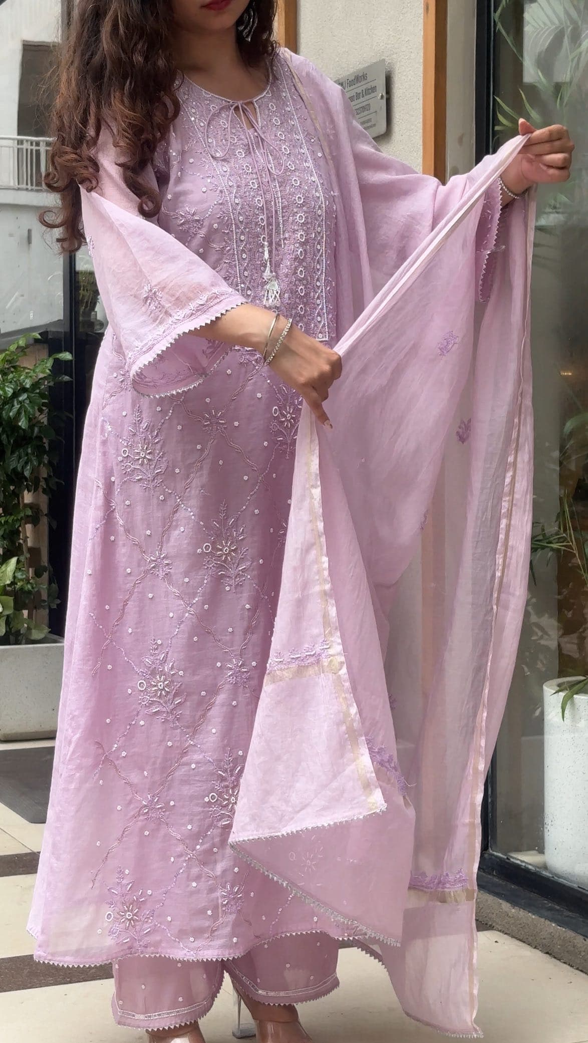 Crafted in Pure Mul Chanderi, this exquisite 3-piece ensemble is a celebration of timeless elegance. Delicate…