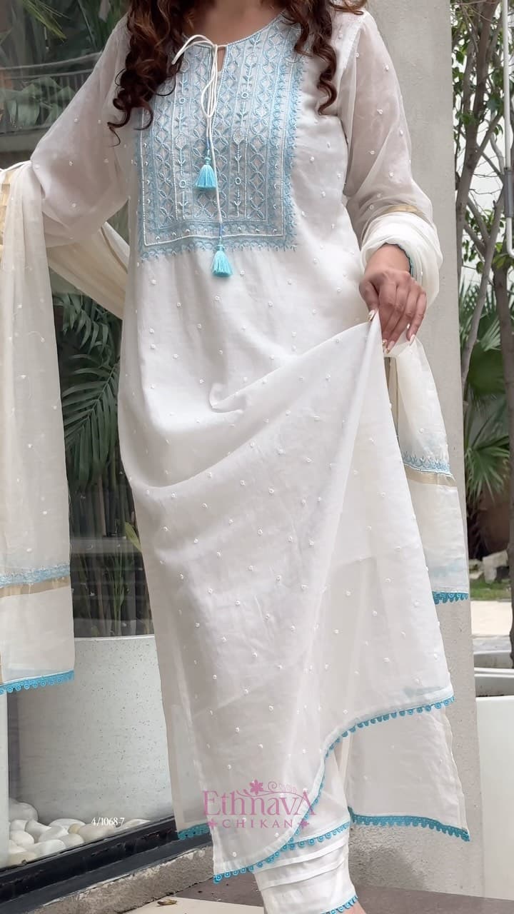 This 3-piece set features intricate blue embroidery, beautifully elevated with delicate Moti and Cutdana work…